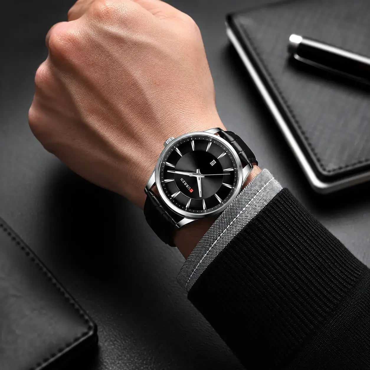 Montclair men’s watch with black leather strap worn on the wrist