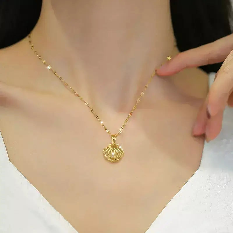 seashell pearl necklace, women’s seashell and pearl necklace, zirconia seashell necklace, elegant seashell necklace, modern pearl necklace, sophisticated women’s necklace, gift necklace for her, elegant beach style seashell necklace, women’s pearl jewellery, delicate seashell pendant necklace, luxury women’s necklace, pearl zirconia necklace gift, stainless steel women’s necklace, birthday gift necklace for women, necklace symbol of protection and love