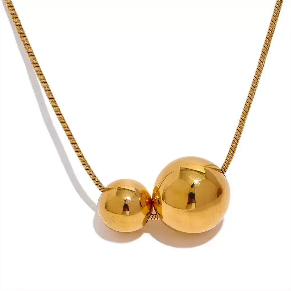 women’s necklace, sphere necklace, gold-plated necklace, elegant jewellery, modern necklace, sophisticated accessory, water-resistant necklace, gift for her, unisex necklace, minimalist necklace, stainless steel necklace, everyday necklace