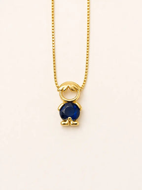 Gold-tone necklace with one boy figure pendant and a blue stone