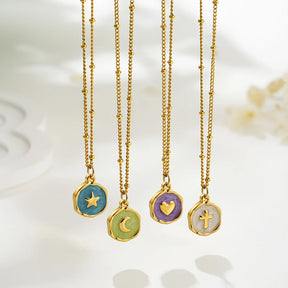 Celeste Talisman Necklace in four styles: star, moon, heart and cross enamel pendants