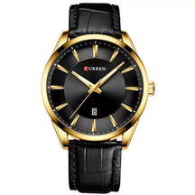 Montclair men’s gold watch with black leather strap and black dial