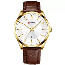Montclair men’s gold watch with brown leather strap and white dial