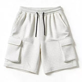 White men's waffle cargo shorts with cargo pockets and elasticated waist